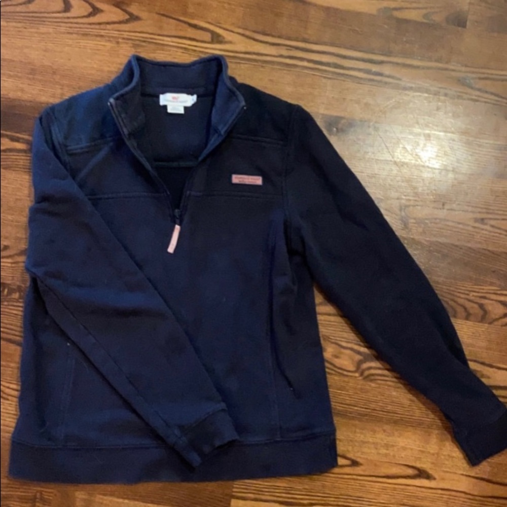 A navy blue vineyard vines quarter zip jacket